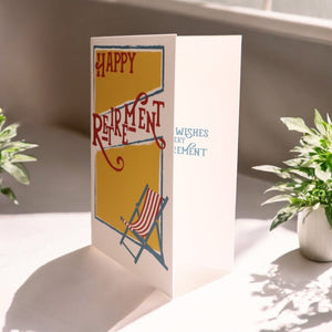 a card with a picture of a chair and a potted plant
