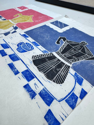Multi-colour jigsaw linocut print of a coffee pot and cup, and blue table cloth