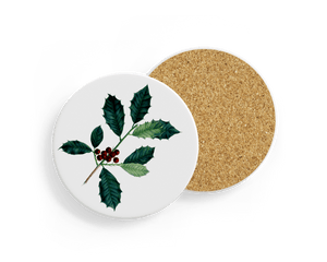 Round ceramic coaster with a botanical holly design, featuring dark green spiky leaves and clusters of red berries on a white background. The reverse side shows a natural cork backing.