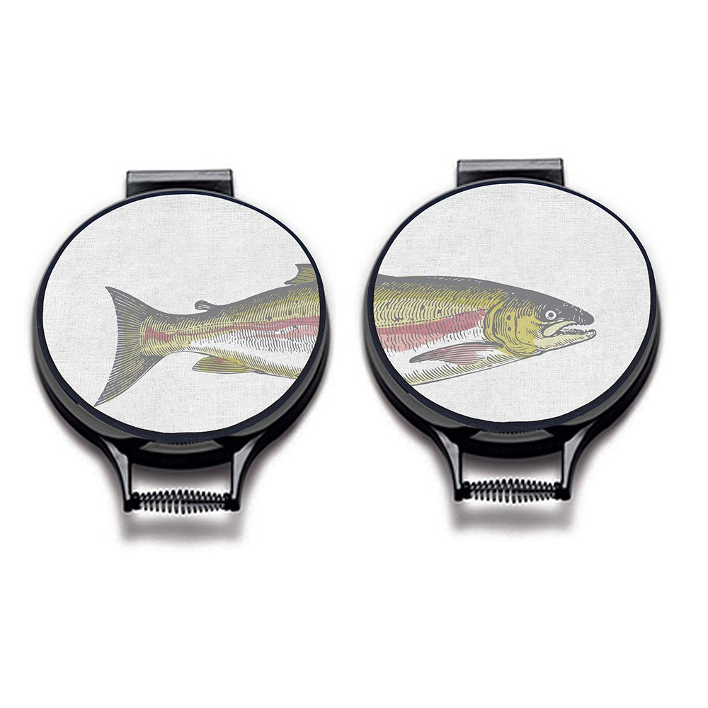 Set of two. painted illustration of a salmon fish with green and pink colouring print on a beige linen circular hobcover with black hemming. Fish head on one hob pad and fish tail of the other hob pad. Pictured on metal cooker lid on an isolated background. Mustard and Gray Severn Salmon Circular Hob Cover
