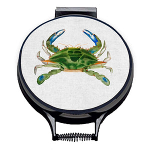 green crab watercolour painting on a beige linen circular hob cover with black hemming. Pictured on metal cooker lid on an isolated background. Mustard and Gray