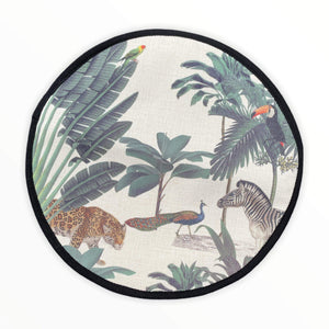 darwin's menagerie tropical print with palms, peacock, zebra, leopard painting on a beige linen circular hob cover with black hemming. Mustard and Gray