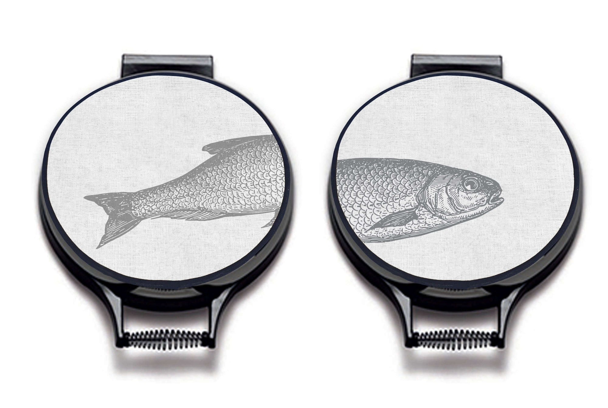 Set of two Ticklerton Hob Pads. Grey fish illustration print on a beige linen circular hob cover with black hemming. Fish head on one pad and fish tail of the other pad. Pictured on metal aga lid on an isolated background. Mustard and Gray