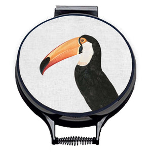 Set of two hob covers. Toco Toucan illustration print on a beige linen circular hob cover with black hemming. Pictured on metal cooker lid on an isolated background. Mustard and Gray