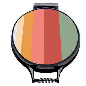 Set of two hob covers. circular hob cover with black hemming. Stripes of Green, red, Pink and orange on one hob cover. Pictured on metal cooker lid on an isolated background. Mustard and Gray