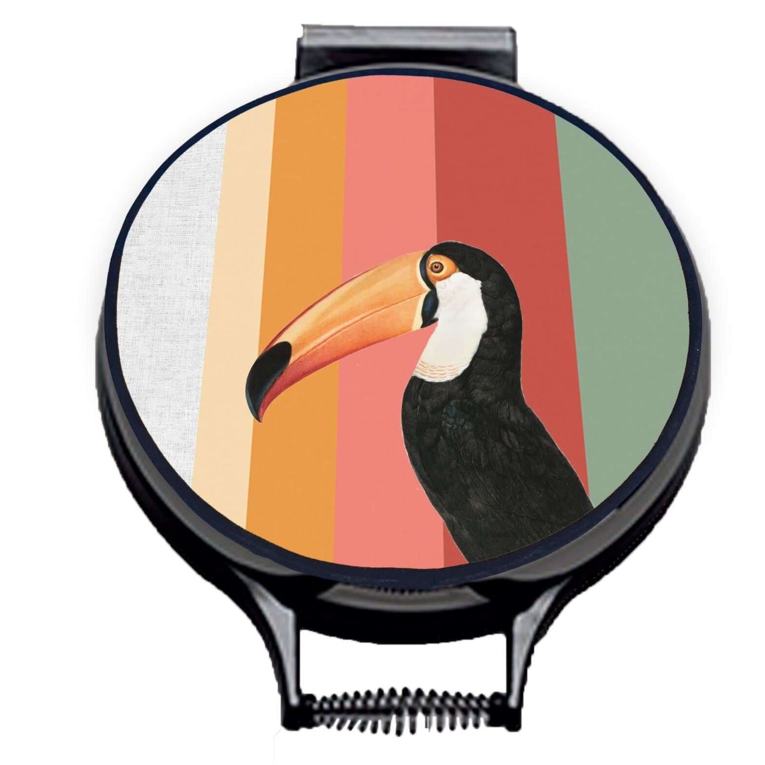Toco Toucan illustration print with stripes of green, red, pink and orange on beige linen circular hob cover with black hemming. Chefs hob cover. Pictured on metal cooker lid on an isolated background. Mustard and Gray